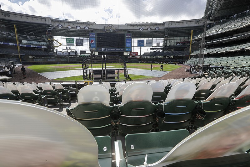 Fan cutouts are seen behind home plate at Miller Park Friday after it was announced that the Milwaukee Brewers home opener was postponed after two St. Louis Cardinals employees tested positive for the coronavirus in Milwaukee. - Photo by Morry Gash of The Associated Press story.lead_photo.caption