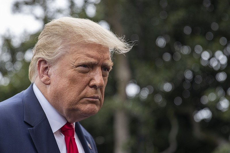 President Donald Trump speaks with reporters as he walks to Marine One on the South Lawn of the White House, Friday, July 31, 2020, in Washington. (AP Photo/Alex Brandon) story.lead_photo.caption
