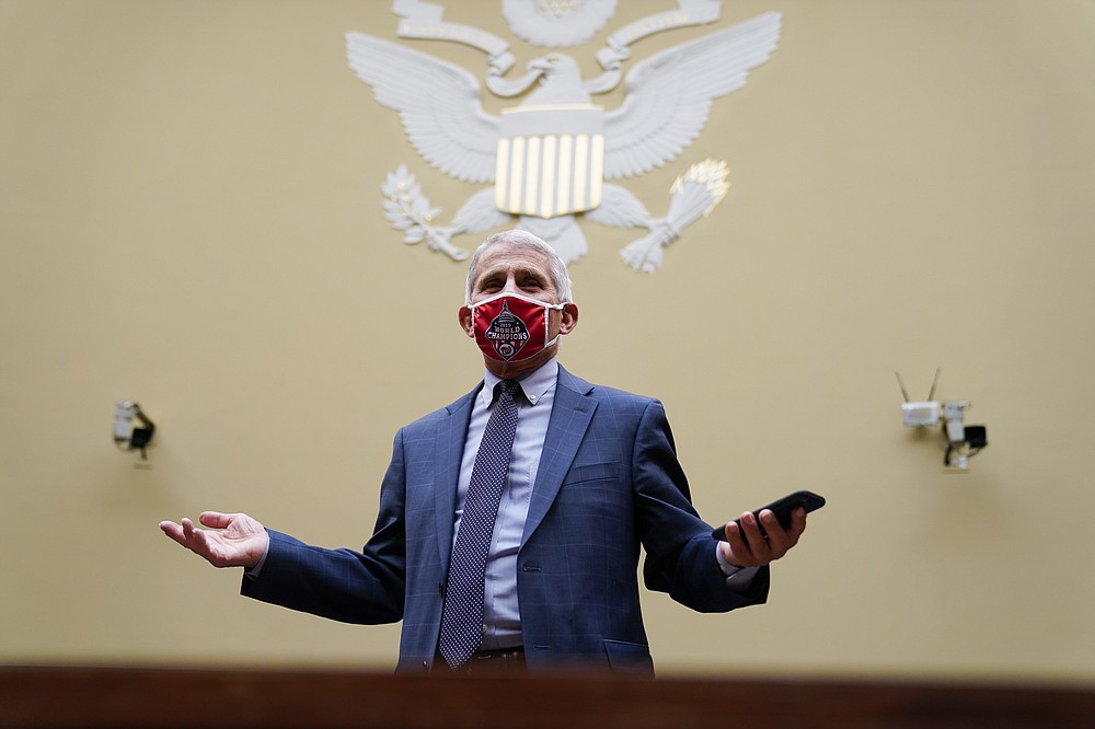 Dr. Anthony Fauci, director of the National Institute for Allergy and Infectious Diseases, arrives to a House Select Subcommittee hearing on the Coronavirus, Friday, July 31, 2020 on Capitol Hill in Washington. (Erin Scott/Pool via AP)
