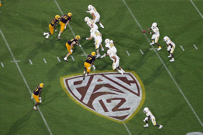 The Pac-12 logo is shown during the second half of an Aug. 29, 2019, NCAA football game between Arizona State and Kent State in Tempe, Ariz. The Pac-12 has set Sept. 26 as the start of its 10-game conference-only football schedule. The Pac-12 announced three weeks ago it would eliminate nonconference games for its 12 member schools. - Photo by Ralph Freso of The Associated Press story.lead_photo.caption