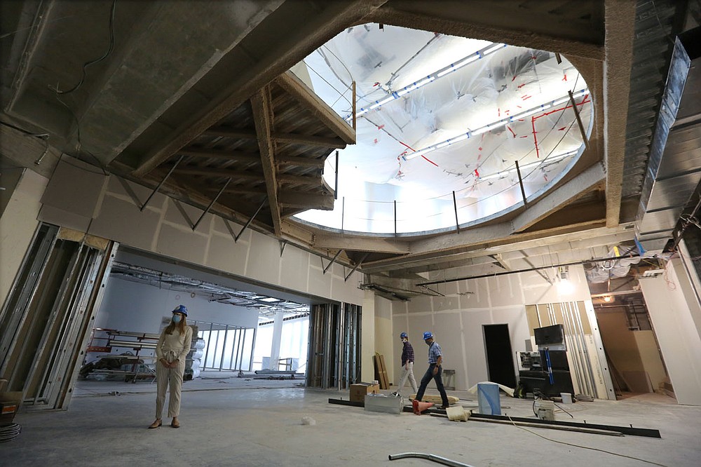 The area where the grand staircase, the linch-pin of the expansion and the existing structure, is visible Thursday, July 30, 2020, during a tour lead by David Johnson, executive director of the Fayetteville Public Library, and Roxi Hazelwood, development and sponsorship coordinator with the Fayetteville Public Library Foundation, of the new expansion area of the library still under construction. The new addition of 82,500-square-feet will nearly double the size of the 88,000-square-foot main library. Check out nwaonline.com/200802Daily/ and nwadg.com/photos for a photo gallery.
(NWA Democrat-Gazette/David Gottschalk)