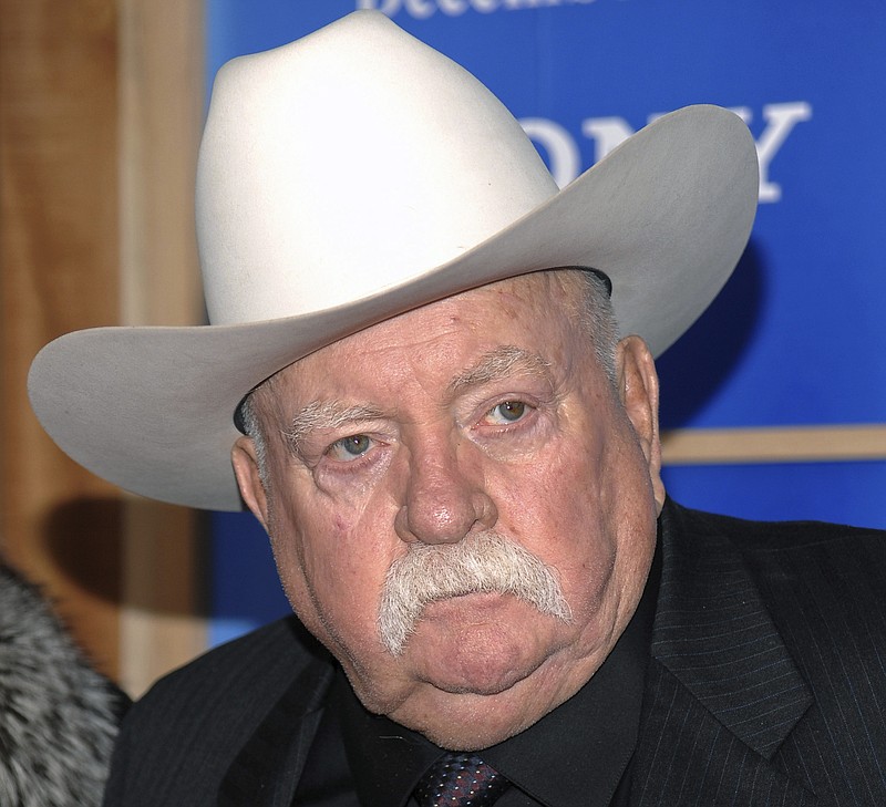 FILE - In this Monday, Dec. 14, 2009 file photo, Actor Wilford Brimley attends the premiere of 'Did You Hear About The Morgans' at the Ziegfeld Theater in New York. Wilford Brimley, who worked his way up from stunt performer to star of film such as “Cocoon” and “The Natural,” has died. He was 85. Brimley’s manager Lynda Bensky said the actor died Saturday morning, Aug. 1, 2020 in a Utah hospital. (AP Photo/Evan Agostini, File)