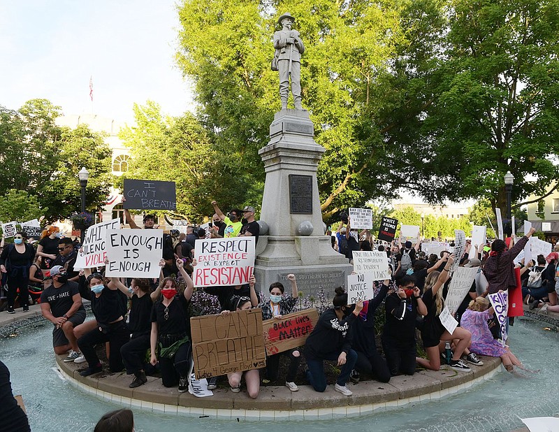 Hundreds of black lives matter protesters fill the Bentonville square Monday June 1, 2020 and around the fountain below a confederate statue. (NWA Democrat-Gazette/Spencer Tirey)