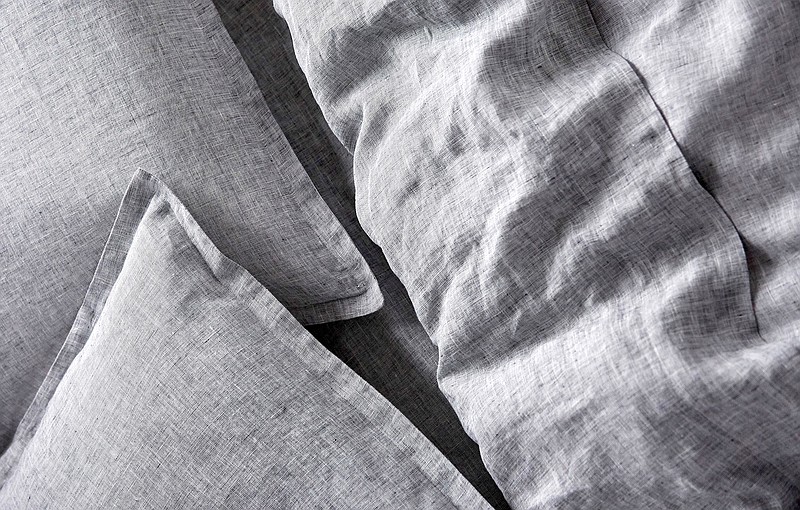 Summer slumber — Linen sheets, like those pictured here, are a summertime favorite because they are light and breathe. They cost more than cotton sheets because of the labor involved in harvesting and processing flax, and not everyone likes their texture. Courtesy of rileyhome.com.