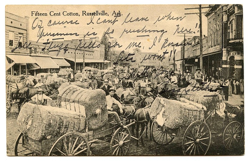 Russellville (1911): "Fifteen cent cotton" was the description of a Main Street full of wagons of bailed cotton brought to town for shipment. "Of course I can’t leave when business is so rushing here!"
Send questions or comments to Arkansas Postcard Past, P.O. Box 2221, Little Rock, Ark. 72203. story.lead_photo.caption