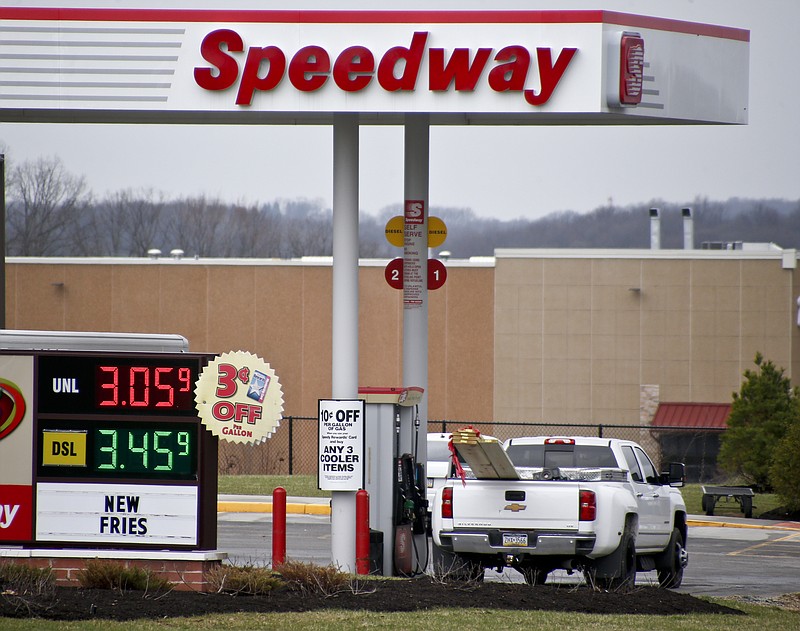 FILE - In this photo made on Wednesday, April 25, 2018, the prices for regular gas and diesel are posted at a Speedway station in Zelienople, Pa. The $21 billion sale of Speedway gas stations buys Marathon Petroleum some breathing room as the global pandemic continues to punish the energy sector. Wall Street focused on the sale to 7-Eleven over the weekend, rather than the huge losses the company posted Monday, Aug. 3, 2020 with a lack of demand for fuel leading to refinery shutdowns. (AP Photo/Keith Srakocic, file)