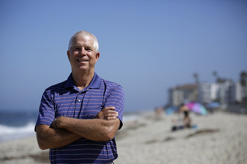 Peter Schnugg stands along the beach on July 31 in San Diego. The former waterpolo athlete missed his chance to go to the Olympics in 1980 when the U.S. decided to boycott the games to protest the Soviet Union's invasion of Afghanistan. Now he's unsure if he'll get the chance to see his niece, Maggie Steffens, try for a third consecutive gold medal with the U.S. women's water polo team. - Photo by Gregory Bull of The Associated Press story.lead_photo.caption