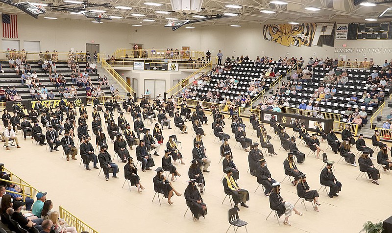 LYNN KUTTER ENTERPRISE-LEADER
Almost the full length of the Tiger Arena basketball court was needed to seat Prairie Grove's 2020 graduating class. The high school held an in-person graduation ceremony Aug. 1 with restrictions in place because of covid-19 concerns. The Class of 2020 had 125 graduates listed on the program.