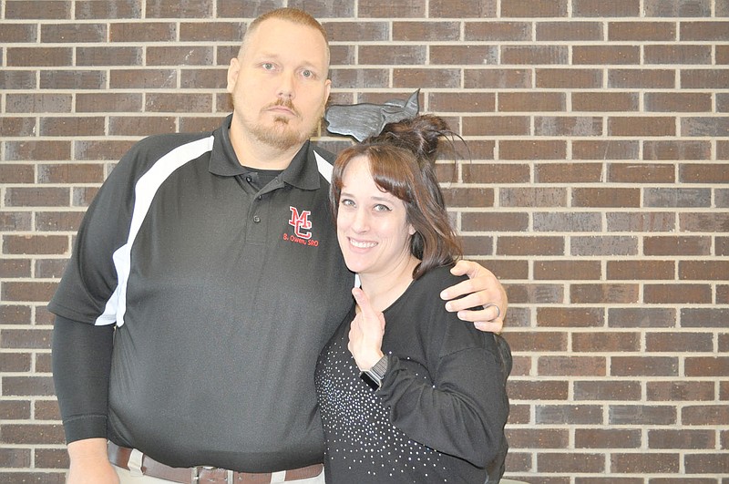 FILE PHOTO School resource officer Buck Owen, left, is pictured earlier this year with high school teacher Joelle Stark. A spaghetti dinner benefit for Owen, who just had a liver transplant, will be at 6 p.m. Friday at the Pineville Community Center.