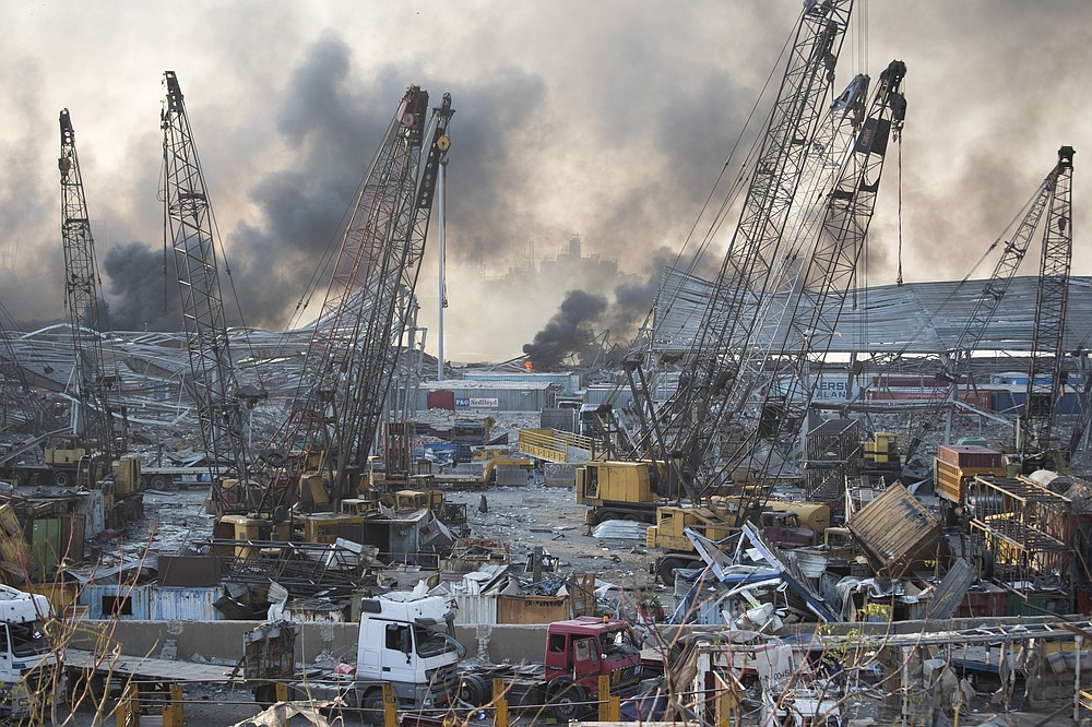 Aftermath of a massive explosion is seen in in Beirut, Lebanon, Tuesday, Aug. 4, 2020. Massive explosions rocked downtown Beirut on Tuesday, flattening much of the port, damaging buildings and blowing out windows and doors as a giant mushroom cloud rose above the capital. Witnesses saw many people injured by flying glass and debris. (AP Photo/Hassan Ammar)