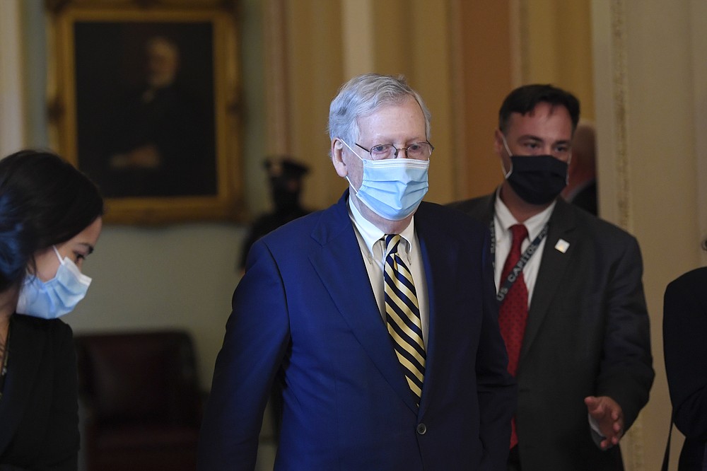 Senate Majority Leader Mitch McConnell of Ky., walks back to his office on Capitol Hill in Washington, Monday, Aug. 3, 2020. (AP Photo/Susan Walsh)