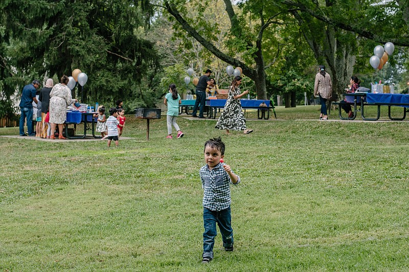 A gathering at Rockville Civic Center in Maryland celebrated the eve of Eid al-Adha on July 30. Asma Uddin’s son, Mikael Ahmed, enjoyed a lollipop, among other sweets.
(The New York Times/Andrew Mangum)