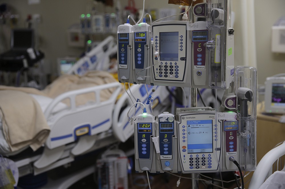 Equipment is hooked up as medical personnel watch over COVID-19 patients at DHR Health, Wednesday, July 29, 2020, in McAllen, Texas. (AP Photo/Eric Gay)