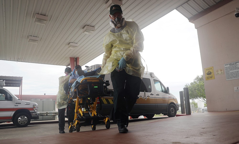 A man arrives at Starr County Memorial Hospital, Tuesday, July 28, 2020, in Rio Grande City, Texas. On America's southern doorstep, the U.S. failure to contain the pandemic has been laid bare. (AP Photo/Eric Gay)