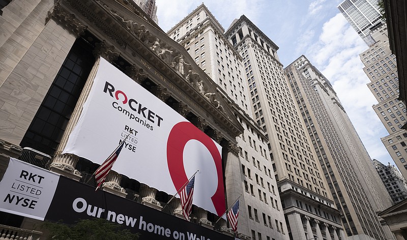 A Rocket Companies sign is displayed on the exterior of the New York Stock Exchange, Thursday, Aug. 6, 2020, in New York. Shares of Rocket Companies, parent of Quicken Loans, began trading Thursday during the Detroit company's IPO at the NYSE. Quicken is the largest retail mortgage originator in the U.S. (AP Photo/Mark Lennihan)