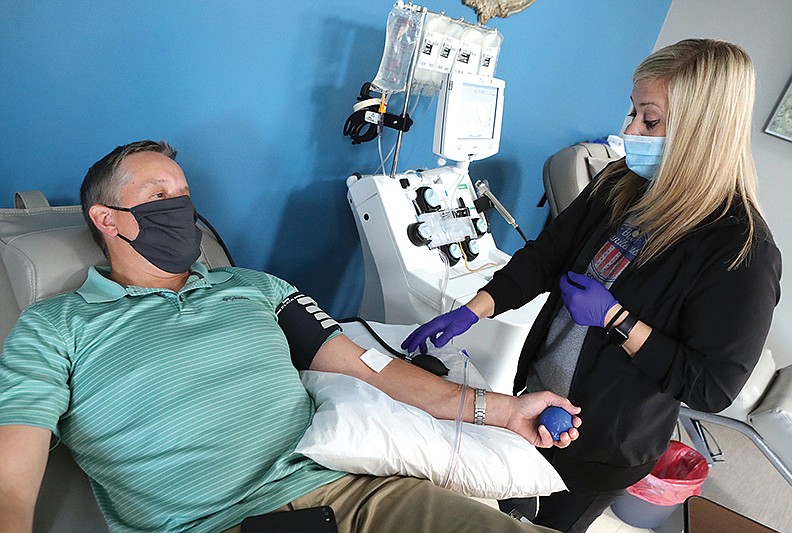 Arkansas Blood Institute Donor Room Supervisor Alexandria Verser, right, prepares U.S. Rep. Bruce Westerman, R-District 4, for a plasma donation Friday at the institute’s Section Line Road location. - Photo by Richard Rasmussen of The Sentinel-Record