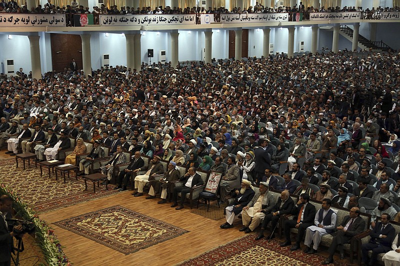 FILE - In this May 3, 2019 file photo, delegates attend the last day of the Afghan Loya Jirga meeting in Kabul, Afghanistan. Afghan officials said a traditional consultative council or Loya Jirga will convene Friday, Aug. 7, 2020, to decide whether the last 400 Taliban prisoners will be released as part of a peace agreement, even as its Health Ministry says half of Kabul’s residents are infected with the coronavirus. The Taliban have rejected any changes to the deal they signed in February with the U.S. (AP Photo/Rahmat Gul, File)