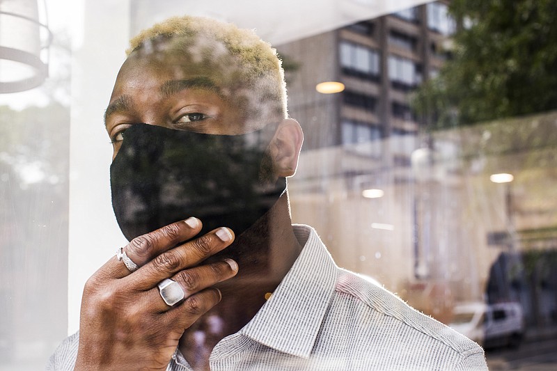 Oyedotun Ajewole of Ministry of Supply wears a mask created with a 3-D-printing machine. MUST CREDIT: photo for The Washington Post by Adam Glanzman.