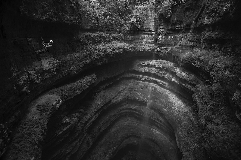 The mouth of Neversink Pit in Fackler, Ala., is an example of the beauty caves have to offer. It also highlights how dangerous the activity can be. (Special to the Democrat-Gazette/Ryan Mauer)