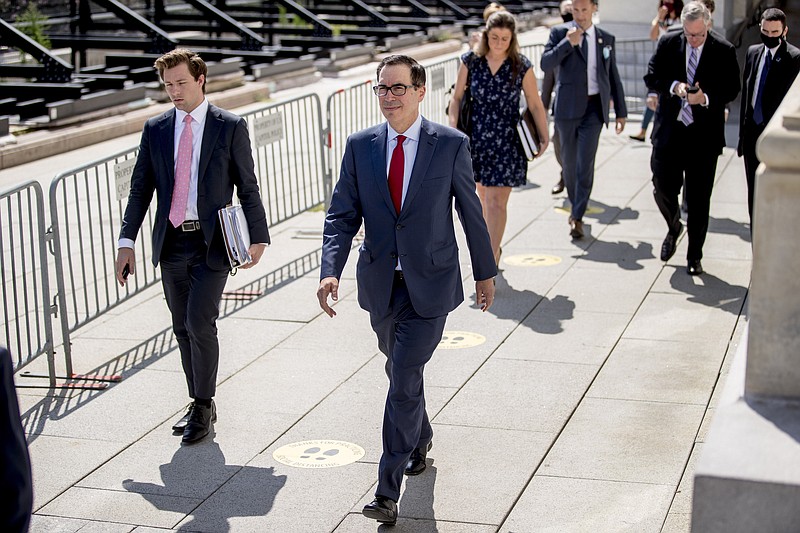 Treasury Secretary Steven Mnuchin, center, and President Donald Trump's Chief of Staff Mark Meadows, second from right, leave following a meeting with House Speaker Nancy Pelosi of Calif. and Senate Minority Leader Sen. Chuck Schumer of N.Y. as they continue to negotiate a coronavirus relief package on Capitol Hill in Washington, Friday, Aug. 7, 2020. (AP Photo/Andrew Harnik) story.lead_photo.caption