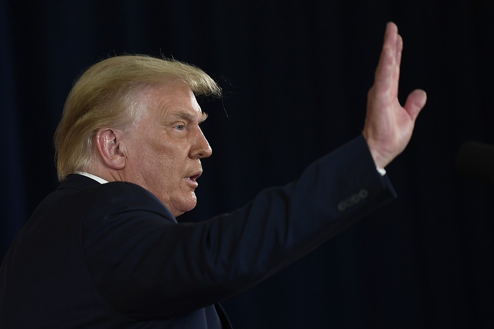President Donald Trump waves goodbye after signing four executive orders during a news conference at the Trump National Golf Club in Bedminster, N.J., Saturday, Aug. 8, 2020. (AP Photo/Susan Walsh)