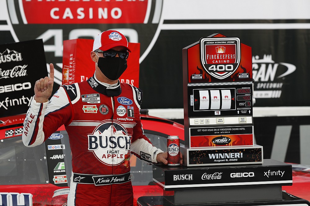 Kevin Harvick celebrates after winning a NASCAR Cup Series auto race at Michigan International Speedway in Brooklyn, Mich., Saturday, Aug. 8, 2020. (AP Photo/Paul Sancya)