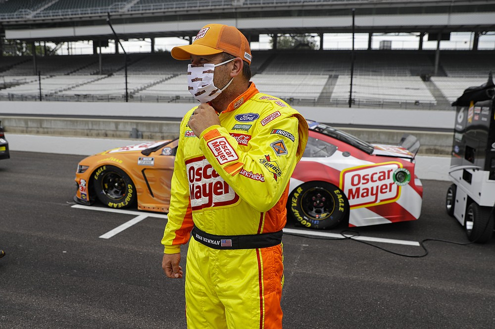Ryan Newman waits in the pit area before a NASCAR Cup Series auto race at Indianapolis Motor Speedway in Indianapolis, Sunday, July 5, 2020. (AP Photo/Darron Cummings)
