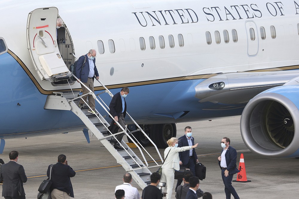 Officials of U.S. Health and Human Services arrive at Taipei Songshan Airport in Taipei, Taiwan, Sunday, Aug. 9, 2020. U.S. Health and Human Services Secretary Alex Azar arrived in Taiwan on Sunday in the highest-level visit by an American Cabinet official since the break in formal diplomatic relations between Washington and Taipei in 1979. (AP Photo/Chiang Ying-ying)