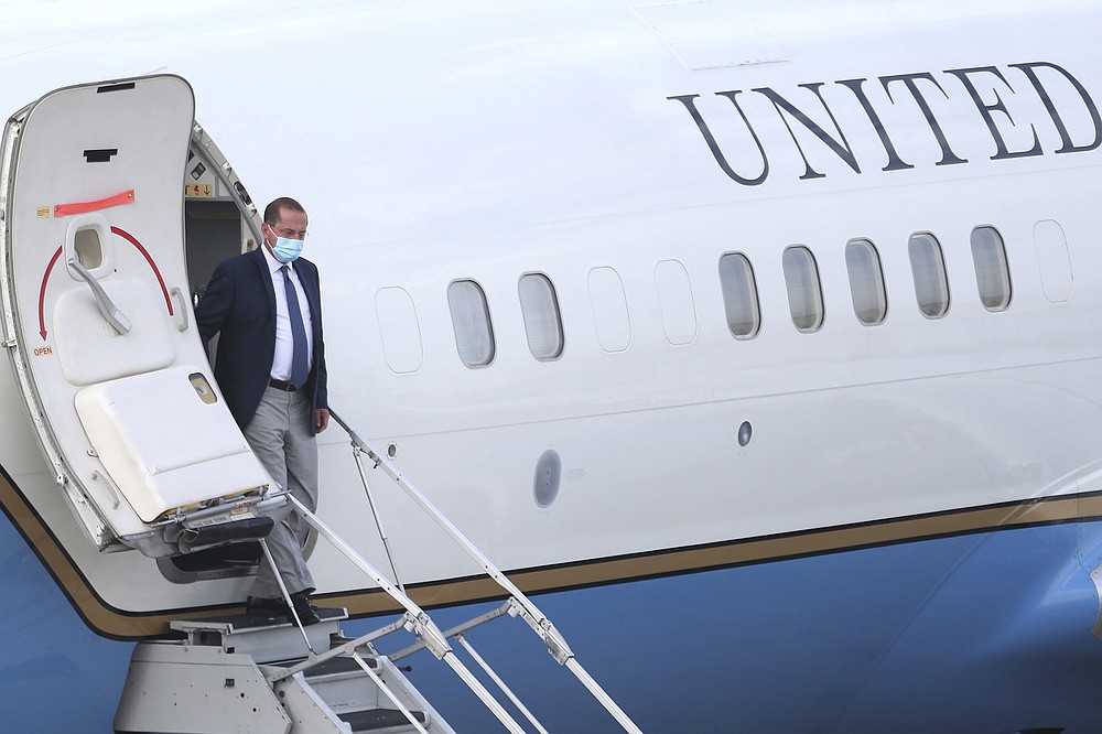 U.S. Health and Human Services Secretary Alex Azar arrives at Taipei Songshan Airport in Taipei, Taiwan, Sunday, Aug. 9, 2020. Azar arrived in Taiwan on Sunday in the highest-level visit by an American Cabinet official since the break in formal diplomatic relations between Washington and Taipei in 1979. (AP Photo/Chiang Ying-ying)