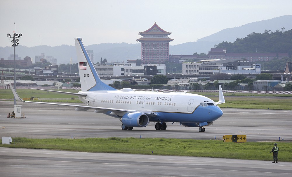 A plane carrying U.S. Health and Human Services Secretary Alex Azar lands at Taipei Songshan Airport in Taipei, Taiwan, Sunday, Aug. 9, 2020. Azar arrived in Taiwan on Sunday in the highest-level visit by an American Cabinet official since the break in formal diplomatic relations between Washington and Taipei in 1979. (AP Photo/Chiang Ying-ying)