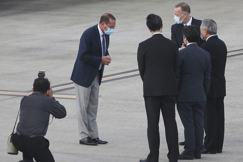 U.S. Health and Human Services Secretary Alex Azar, second left, greets Taiwanese officers as he arrives at Taipei Songshan Airport in Taipei, Taiwan, Sunday. Azar arrived in Taiwan on Sunday in the highest-level visit by an American Cabinet official since the break in formal diplomatic relations between Washington and Taipei in 1979. - AP Photo/Chiang Ying-ying