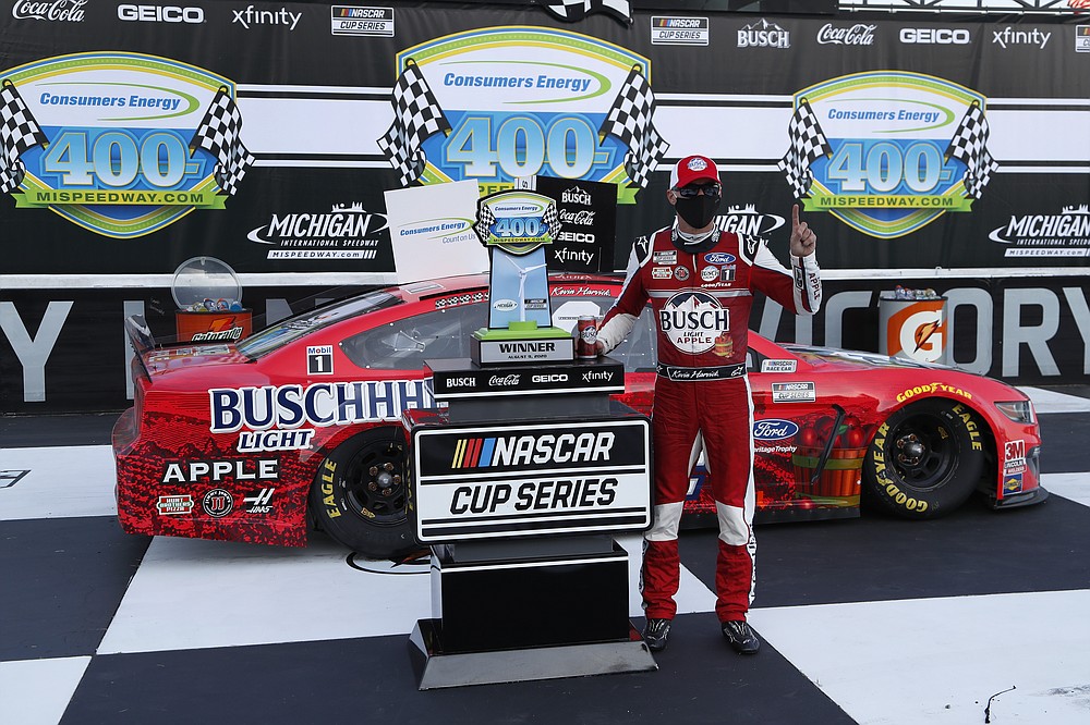 Kevin Harvick celebrates after winning a NASCAR Cup Series auto race at Michigan International Speedway in Brooklyn, Mich., Sunday, Aug. 9, 2020. (AP Photo/Paul Sancya)