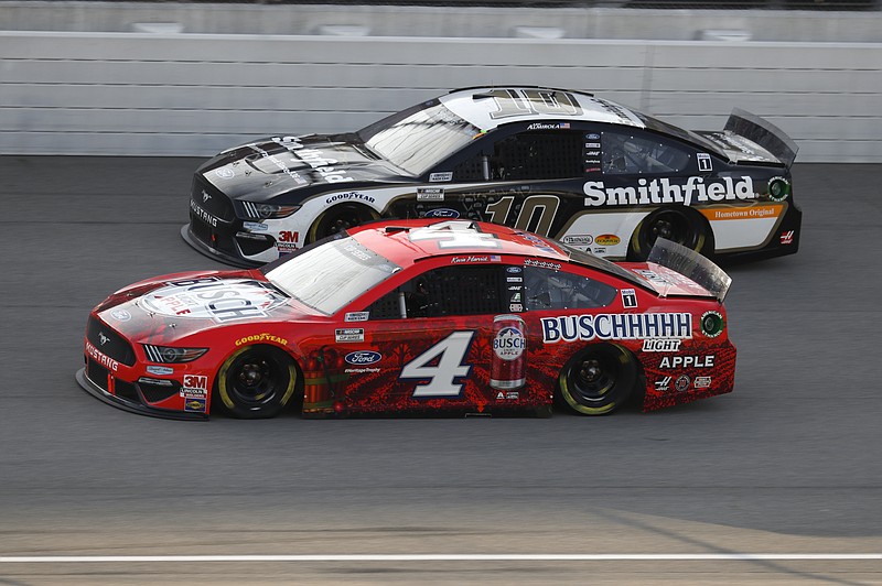 Kevin Harvick (4) races Aric Almirola (10) during the NASCAR Cup Series auto race at Michigan International Speedway in Brooklyn, Mich., Sunday, Aug. 9, 2020. (AP Photo/Paul Sancya)