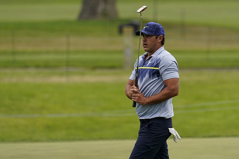 Brooks Koepka reacts after missing a putt on the sixth hole during the final round of the PGA Championship golf tournament at TPC Harding Park Sunday, Aug. 9, 2020, in San Francisco. (AP Photo/Jeff Chiu)