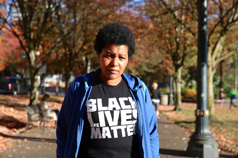 Teressa Raiford, of Don't Shoot Portland, poses for a photo on Oct. 31, 2017, in Portland, Ore. Protests in Portland have topped the headlines for days, but lost in the shouting are the voices of Black residents themselves Raiford, who is also a former mayoral candidate, said people who are questioning the legitimacy of protest through so-called “direct action” against police are on “the wrong side of history.” (Jim Ryan/The Oregonian via AP)