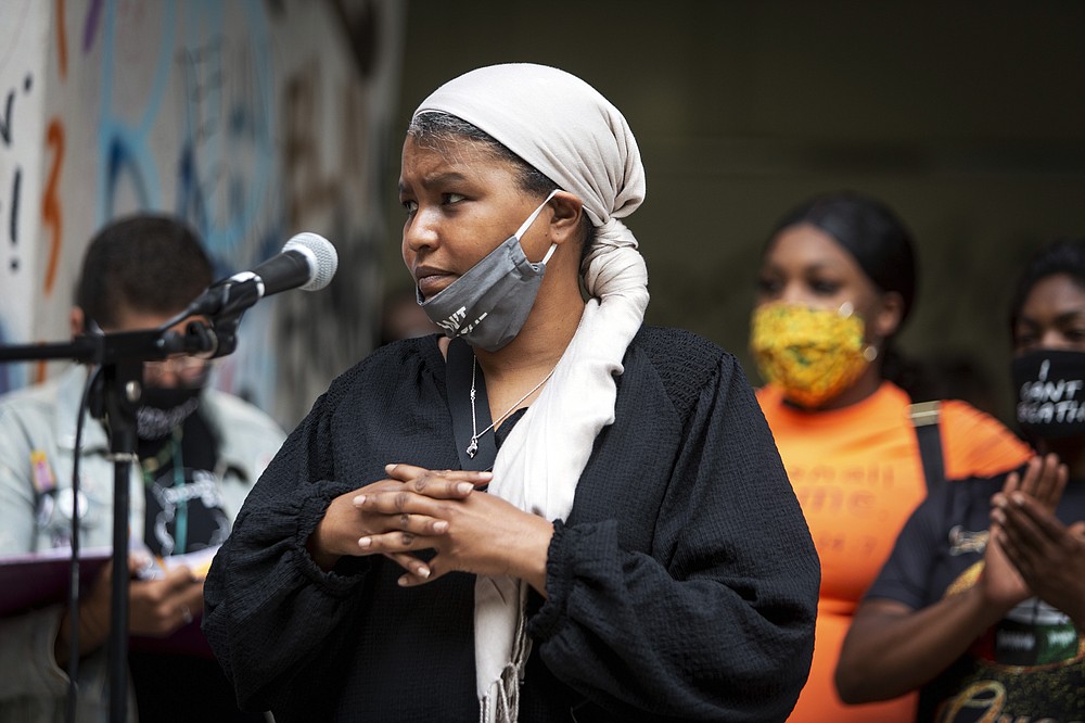Teressa Raiford, executive director of Don't Shoot Portland, speaks in front of a crowd gathered in front of the Mark O. Hatfield Federal Courthouse in downtown Portland, Ore., on July 17, 2020, with several religious leaders calling for non-violent protests and greater accountability from local and federal officials. Other speakers called for an end to racial injustice. Protests in Portland have topped the headlines for days, but lost in the shouting are the voices of Black residents themselves. Their feelings about the unrest are nuanced and diverse. (Brooke Herbert/The Oregonian via AP)