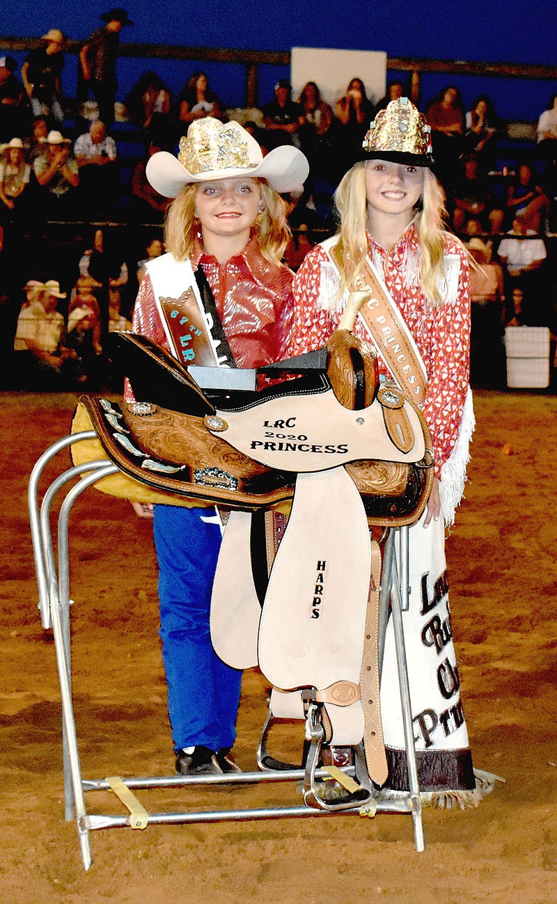 MARK HUMPHREY  ENTERPRISE-LEADER/Paisley Teague, of Siloam Springs (left), was crowned Lincoln Riding Club princess by 2019 princess Bailey Sizemore during Saturday's rodeo performance at the 67th annual Lincoln Rodeo.