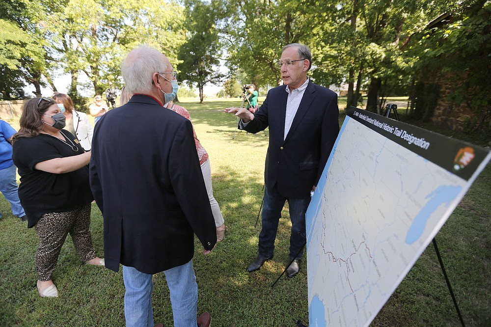 U.S. Senator John Boozman (right) speaks with those in attendance Monday, August 10, 2020, after he announced he has filed a bill to make the Butterfield Overland Trail a national historic trail in Springdale. The Fitzgerald Station site was a stagecoach stop on the Butterfield Overland Mail route in the 1850s. About 337 miles of the 3,000 miles of the two branches of the historic trail went through Arkansas. Check out nwaonline.com/200811Daily/ and nwadg.com/photos for a photo gallery.
(NWA Democrat-Gazette/David Gottschalk)