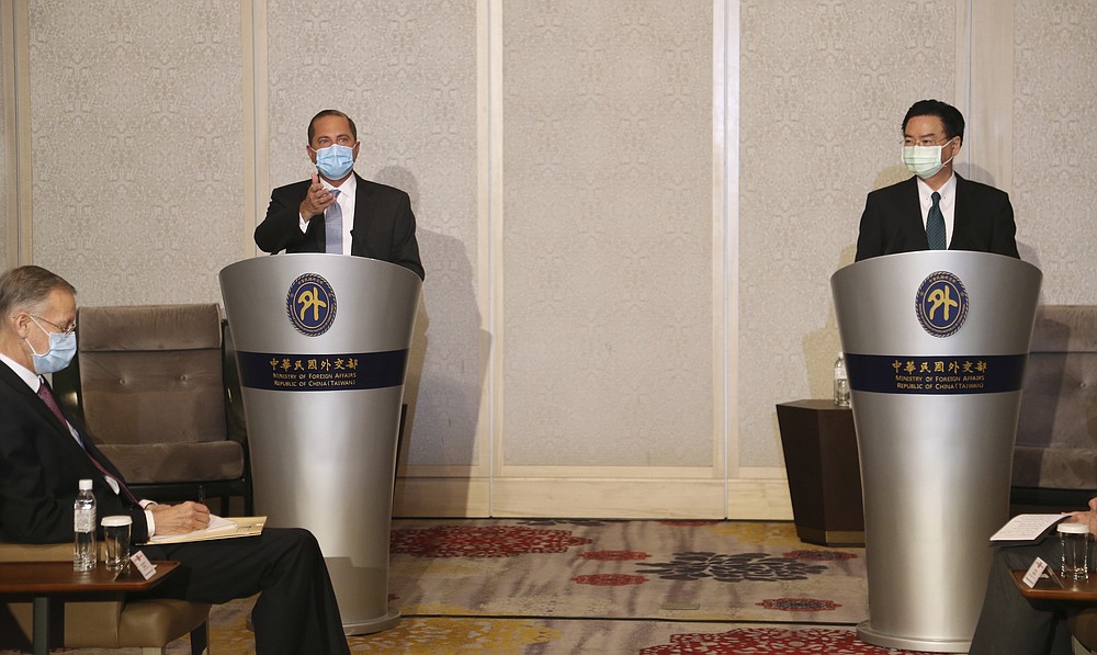 U.S. Health and Human Services Secretary Alex Azar, left, speaks during a meeting with Taiwanese Foreign Minister Joseph Wu in Taipei, Taiwan Tuesday, Aug. 11, 2020. Azar met with Wu on Tuesday during the highest-level visit by an American Cabinet official since the break in formal diplomatic ties between Washington and Taipei in 1979. (AP Photo/Chiang Ying-ying)