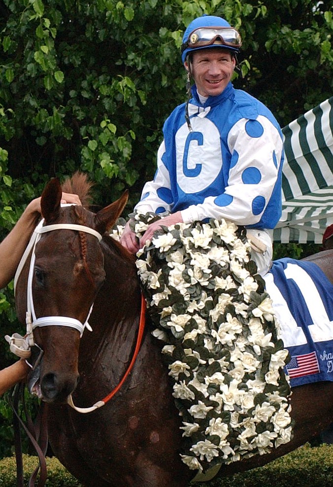 Jockey Stewart Elliott sits aboard Smarty Jones in the winners circle after winning the 68th running of the Arkansas Derby on April 10, 2004, at Oaklawn Park. Elliott is the latest jockey to reach the 5,000 win mark. - The Sentinel-Record file photo