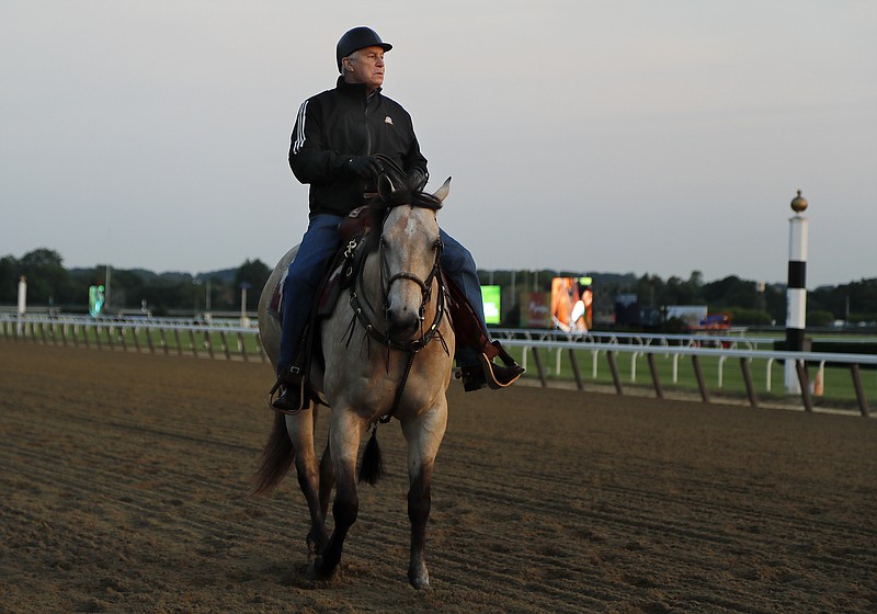 Trainer Wayne Lukas rides along the main track on June 8, 2018, while watching thoroughbreds workout at Belmont Park in Elmont, N.Y. The Hall of Fame trainer recently contracted COVID-19 and is recovering at home in Lexington, Ky. - Photo by Julie Jacobson of The Associated Press