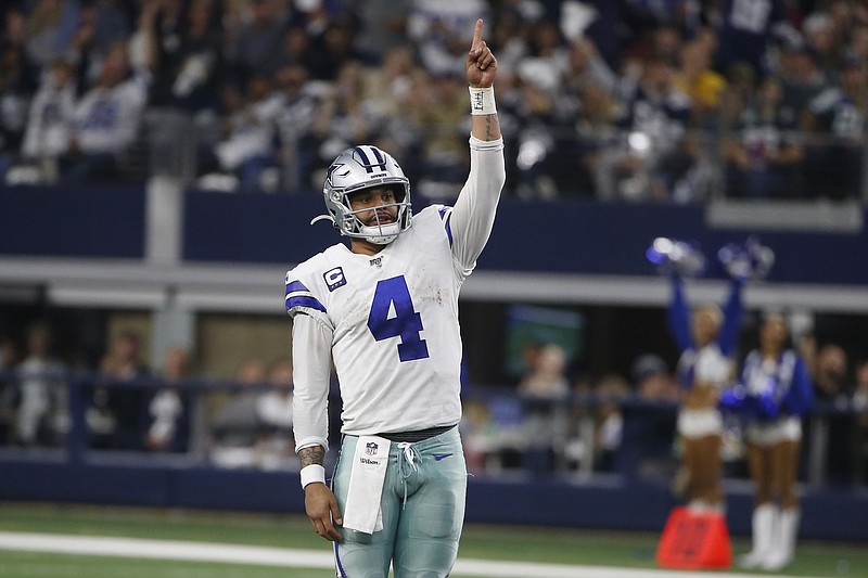Dallas Cowboys quarterback Dak Prescott (4) celebrates a touchdown against the Washington Redskins during the second half of a Dec. 15, 2019, NFL game in Arlington, Texas. Prescott stuck with his virtual hiatus trying to get a long-term contract that never came during the offseason. Now that the star quarterback of the Dallas Cowboys is in the building preparing to play on the $31.4 million franchise tag, Prescott doesn't see an immediate need for questions about his future with America's Team. - Photo by Ron Jenkins of The Associated Press