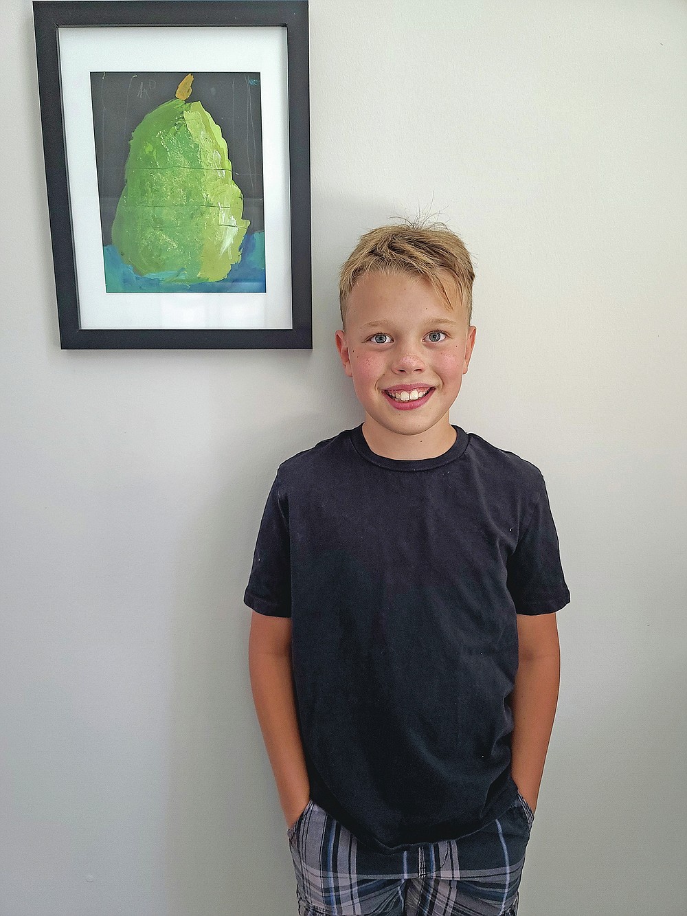This image released by Elle Anderson shows a portrait of her son Aiden Anderson, 11, in Orlando. Anderson will begin sixth grade at home for two weeks, then happily head out to school in a state that's among the nation's worst hot spots for the virus. (Elle Anderson via AP)