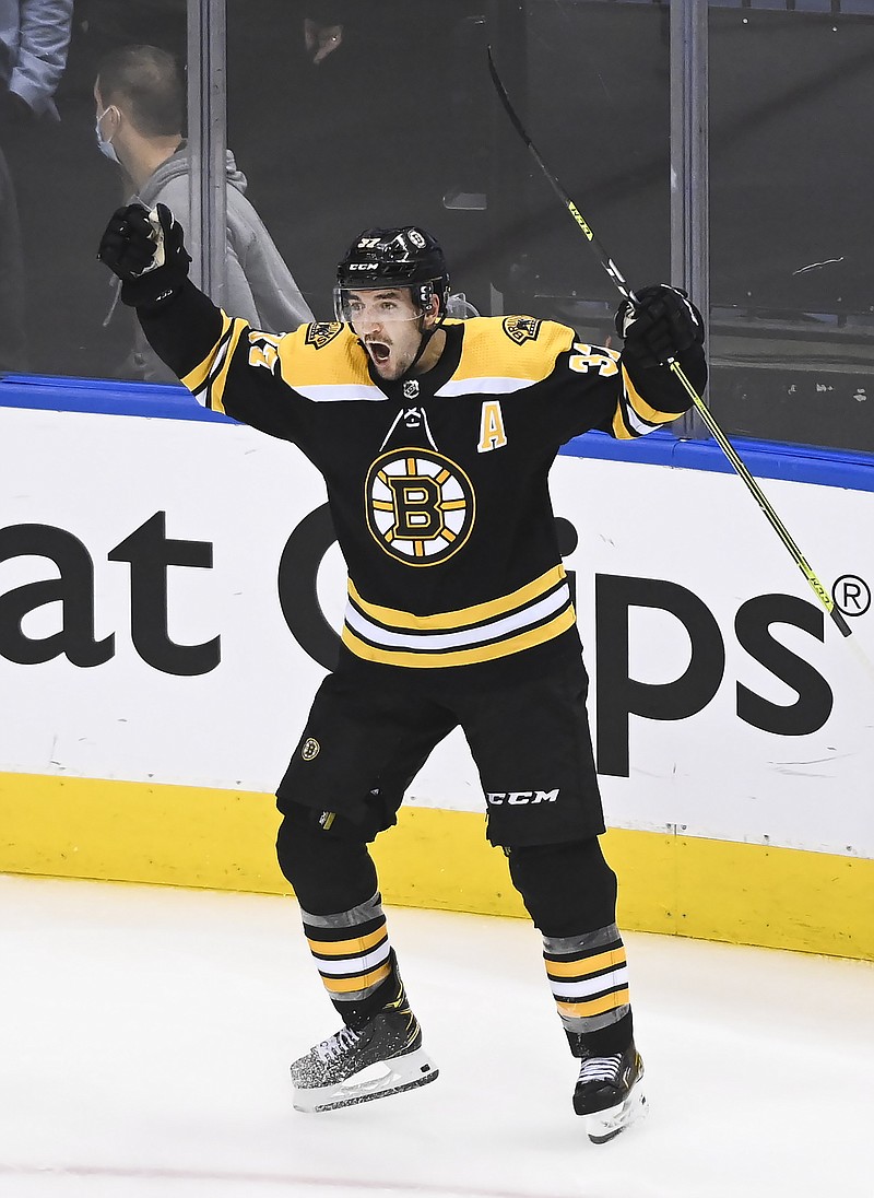 Bruins beat Hurricanes 4-3 in 2 OT in game delayed 15 hours