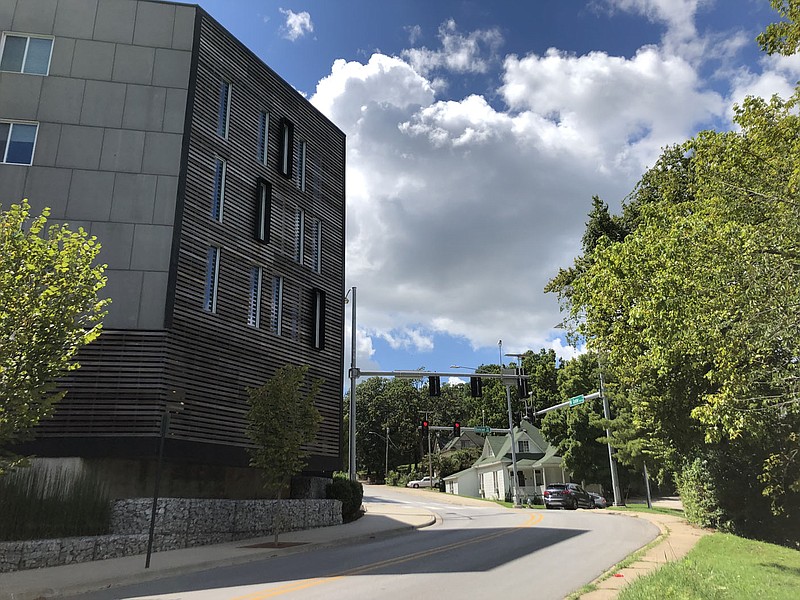 A house is seen Wednesday, Aug. 12, 2020, near a student apartment complex at Center Street and Duncan Avenue in downtown Fayetteville. The City Council is considering creating a landlord registry for property owners who own lease more than two properties. (NWA Democrat-Gazette/Stacy Ryburn)