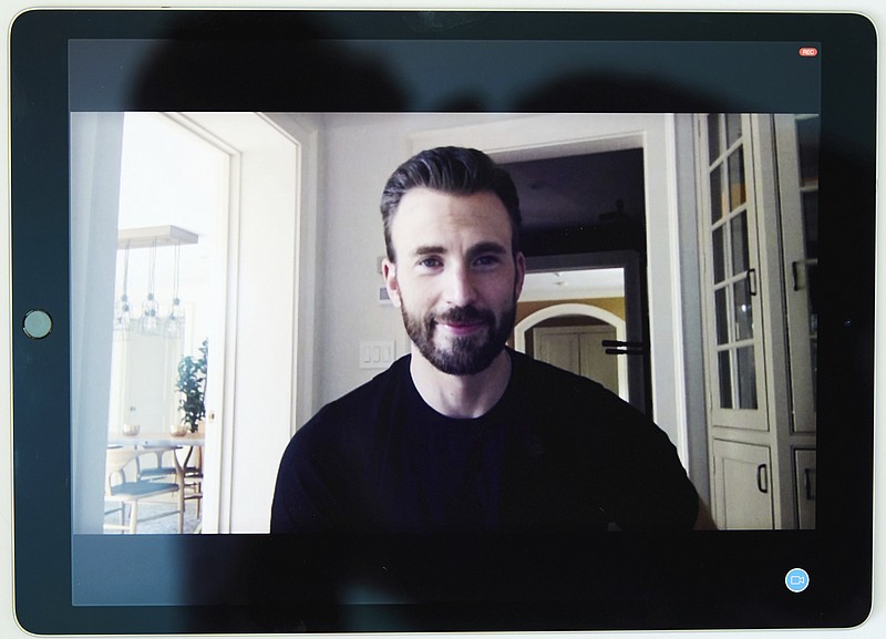 In this July 30, 2020 photo, Chris Evans, co-founder of the civic engagement video-based app "A Starting Point" with Mark Kassen, is photographed on a tablet during a remote portrait session with photographer in Los Angeles and subject in Boston, Mass. (Photo by Matt Sayles/Invision/AP)