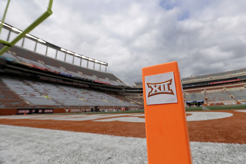 FILE - In this Oct. 7, 2017, file photo, a Big 12 pylon marks the end zone at Darrell K Royal Texas Memorial Stadium before an NCAA college football game between Texas and Kansas State in Austin, Texas. Big 12 schools have agreed to play one nonconference football game this year to go along with their nine league contests as plans for the pandemic-altered season continued to fall into place. (AP Photo/Eric Gay, File)
