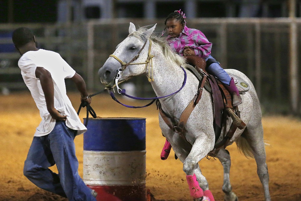 Cowboys in masks, but Black rodeo goes on