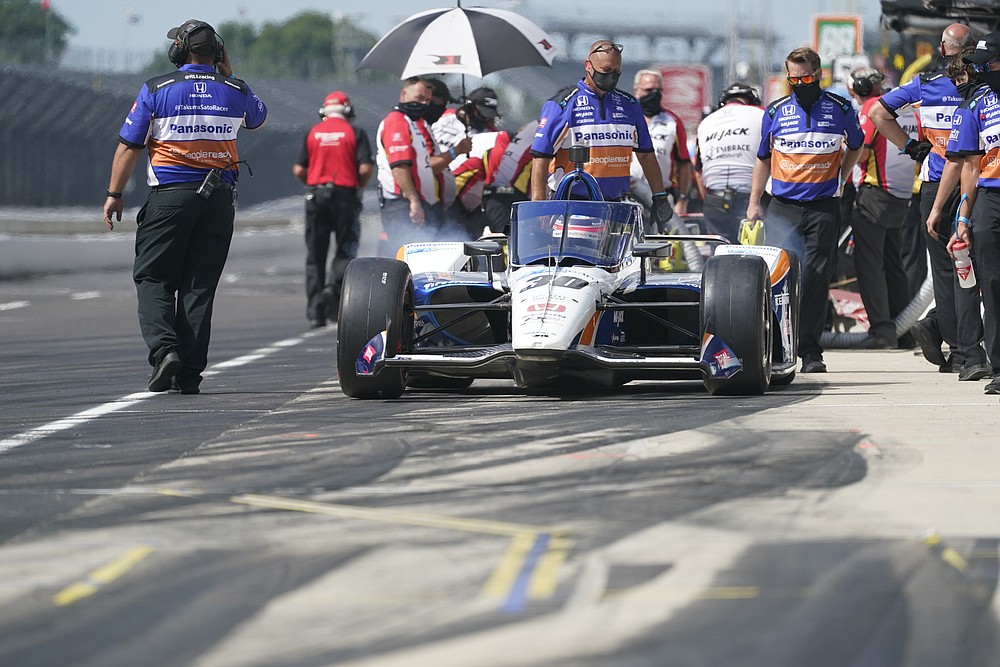 Takuma Sato, of Japan, pulls out of the pits during a practice session for the Indianapolis 500 auto race at Indianapolis Motor Speedway, Friday, Aug. 14, 2020, in Indianapolis. (AP Photo/Darron Cummings)