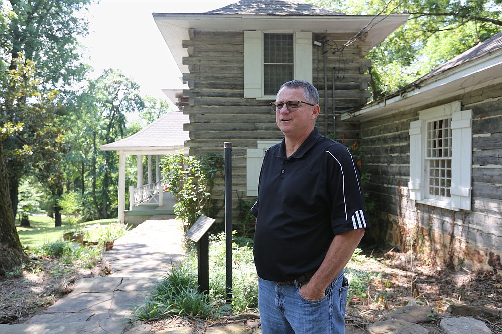 Chad Wolf, director of the city of Springdale Parks and Recreation, describes the exterior of Rabbit Foot Lodge Wednesday, August 5, 2020, located on the north end of J.B. Hunt Park in Springdale. The lodge was built in 1908-09 and placed on the National Register of Historic Places by the United States Department of the Interior in 1986. Check out nwaonline.com/200809Daily/ and nwadg.com/photos for a photo gallery.
(NWA Democrat-Gazette/David Gottschalk)